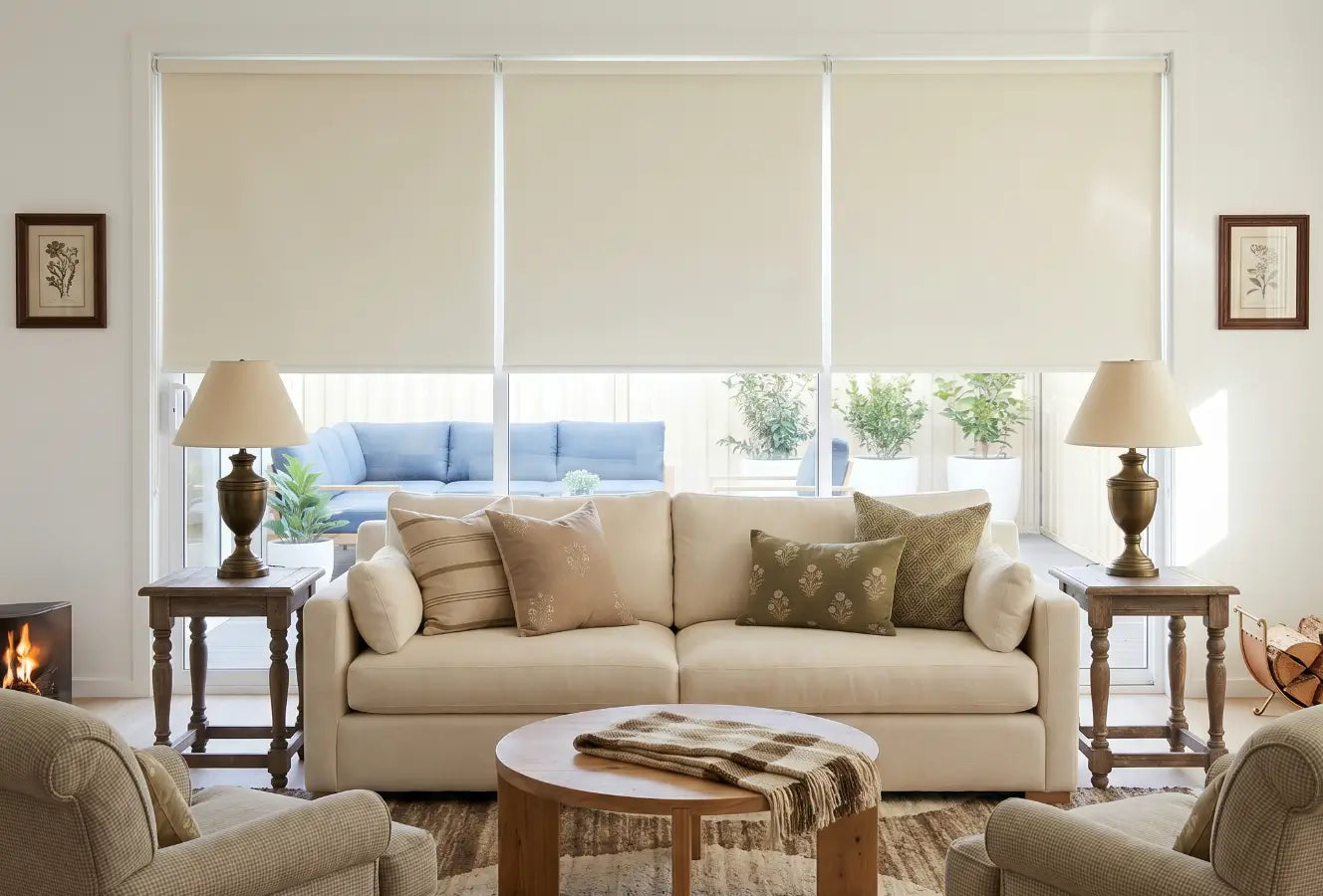 Living room with beige sofa, coffee table, and roller blinds on windows