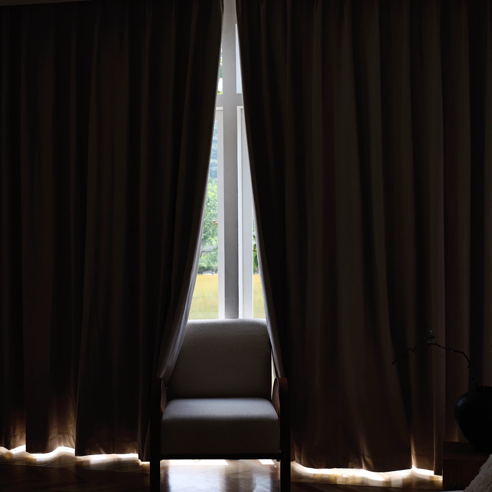 Brynna OY16-318-2_scene_3 100% Blackout Devoré Velvet Drapes in a modern home interior with elegant drape and luxurious texture