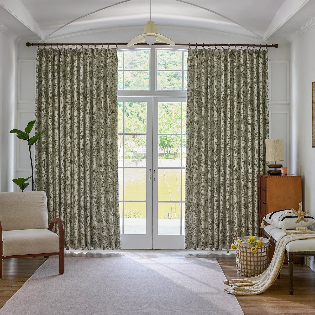 Cymbel H-002_scene_1 green vintage floral jacquard chenille blackout drapes, styled in a bright living room setting showcasing full window coverage and elegant home decor