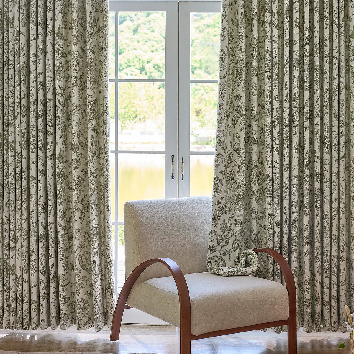 Cymbel H-002_scene_10 green vintage floral jacquard chenille blackout drapes, styled in a bright living room setting showcasing full window coverage and elegant home decor