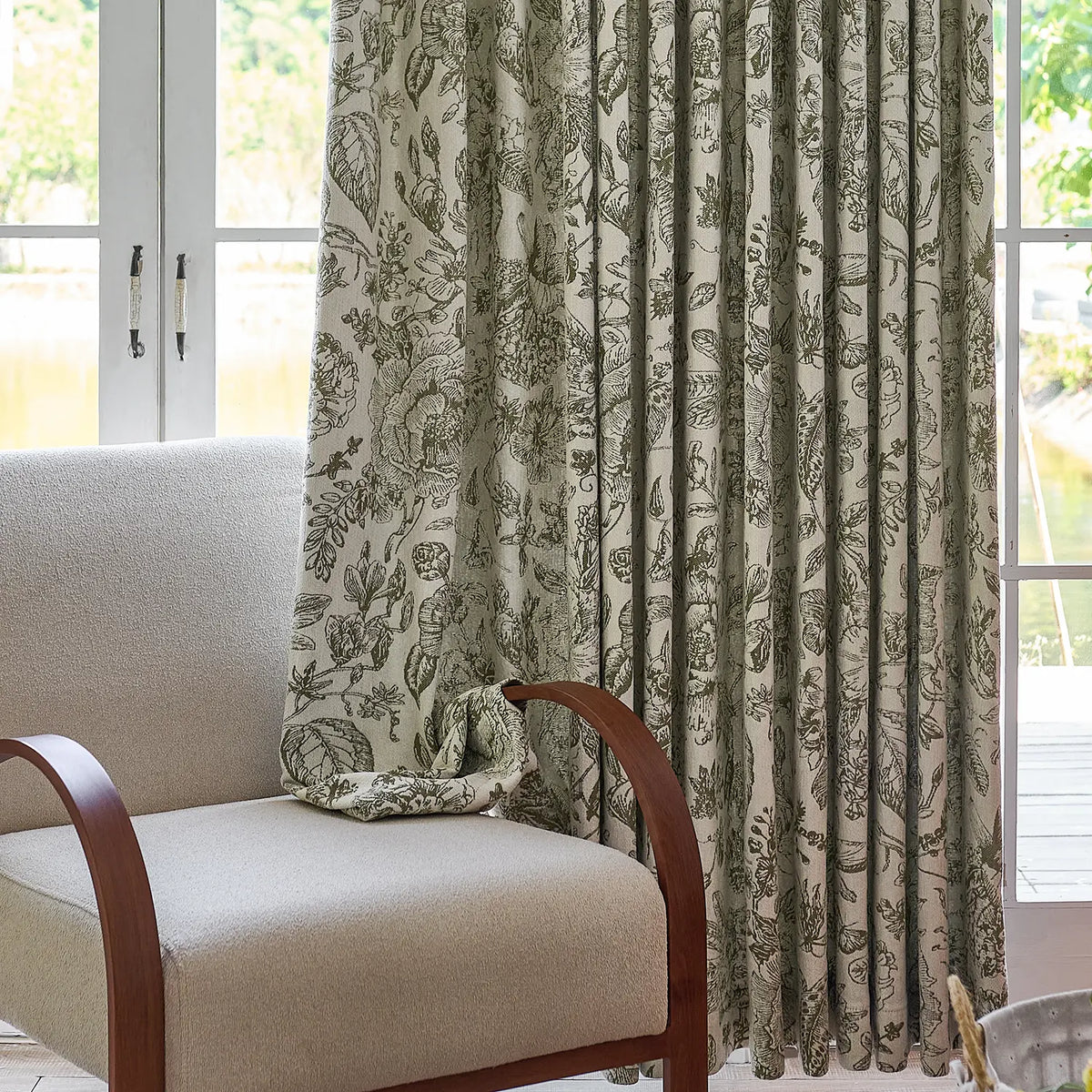 Cymbel H-002_scene_11 green vintage floral jacquard chenille blackout drapes, styled in a bright living room setting showcasing full window coverage and elegant home decor