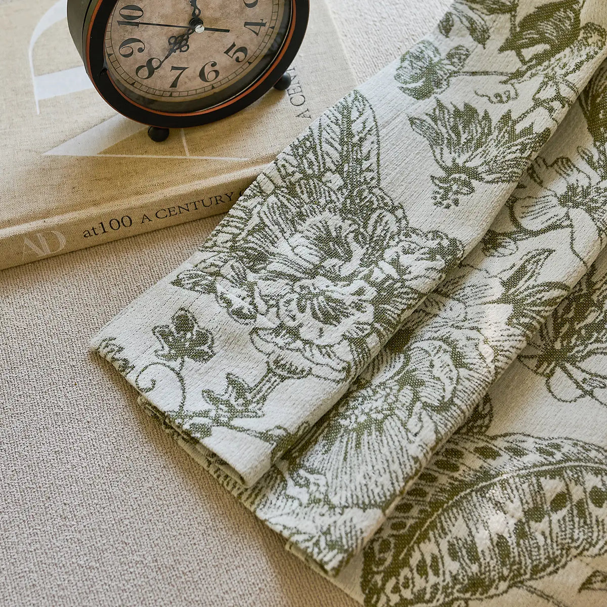 Cymbel H-002_scene_14 green vintage floral jacquard chenille blackout drapes, styled in a bright living room setting showcasing full window coverage and elegant home decor