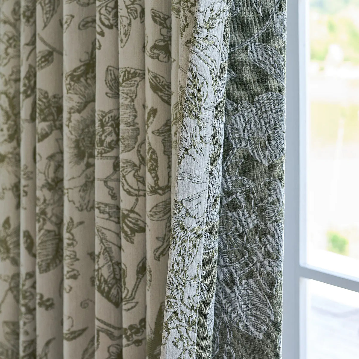Cymbel H-002_scene_15 green vintage floral jacquard chenille blackout drapes, styled in a bright living room setting showcasing full window coverage and elegant home decor