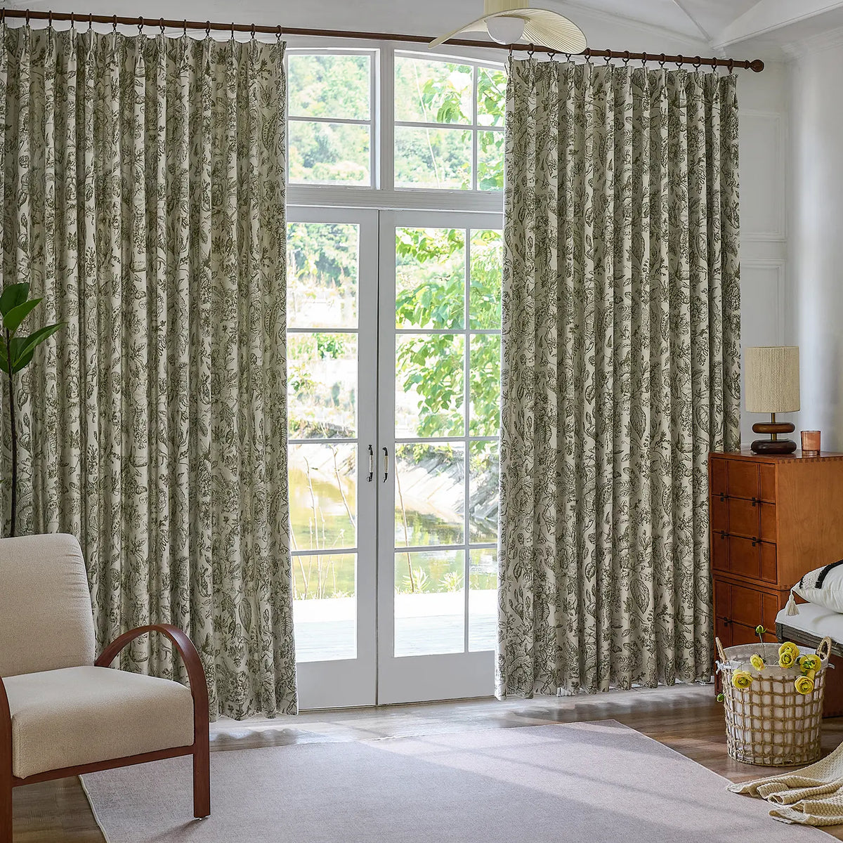 Cymbel H-002_scene_3 green vintage floral jacquard chenille blackout drapes, styled in a bright living room setting showcasing full window coverage and elegant home decor
