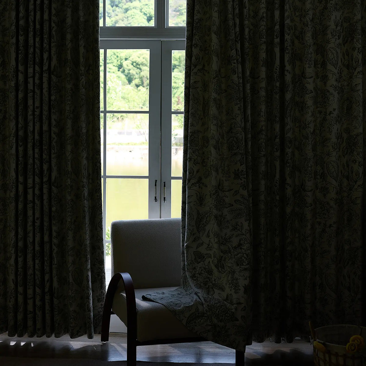 Cymbel H-002_scene_7 green vintage floral jacquard chenille blackout drapes, styled in a bright living room setting showcasing full window coverage and elegant home decor