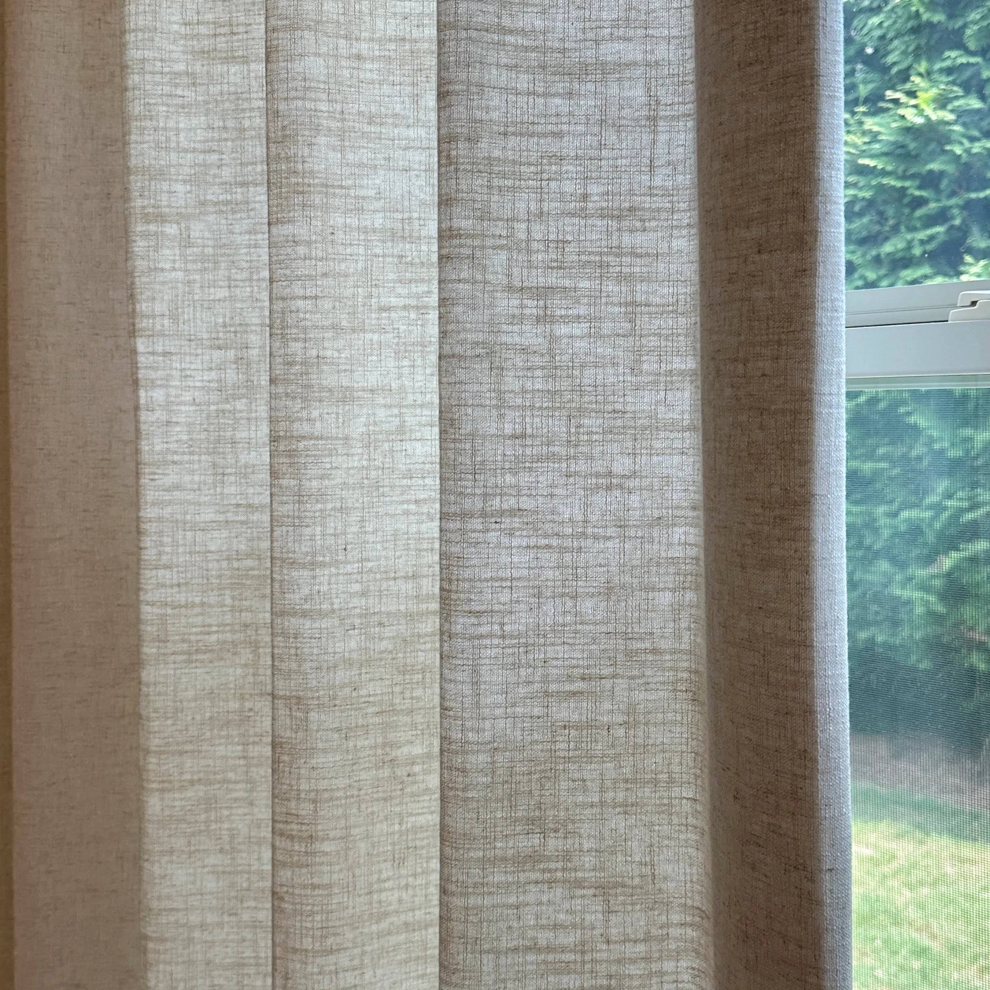 Elara linen curtains 89850-2-3, elegant drapes showcased to display the product's soft texture and graceful hanging effect