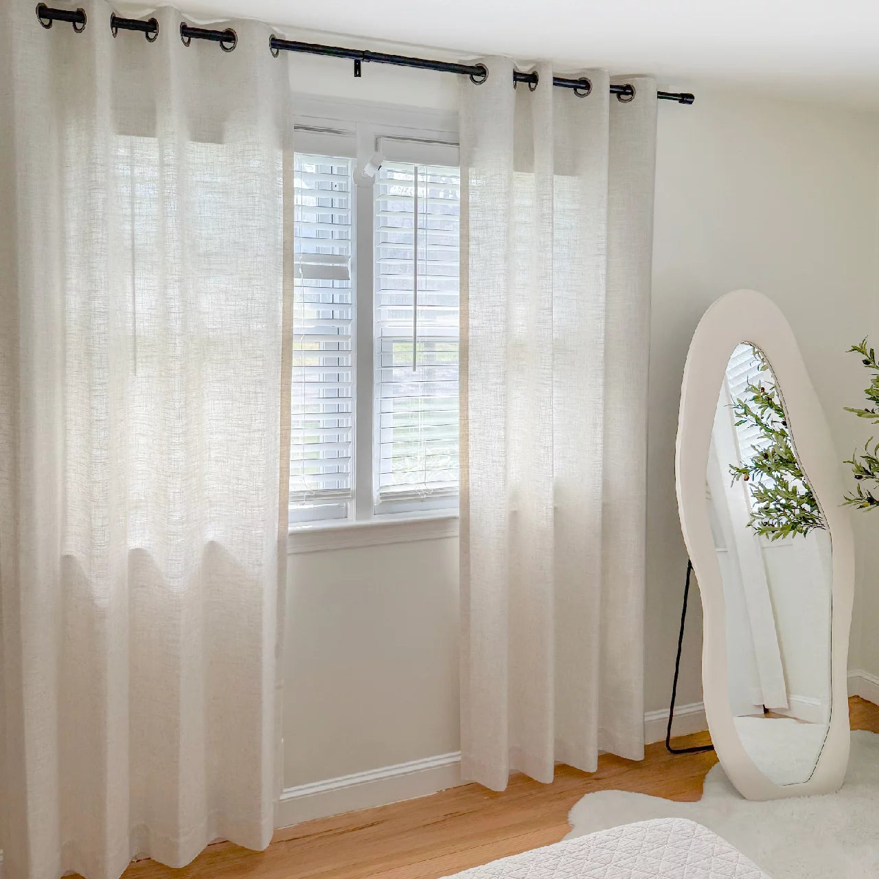 Elara linen curtains elegant drapes in a dining room showcased to display the product's soft texture and graceful hanging effect