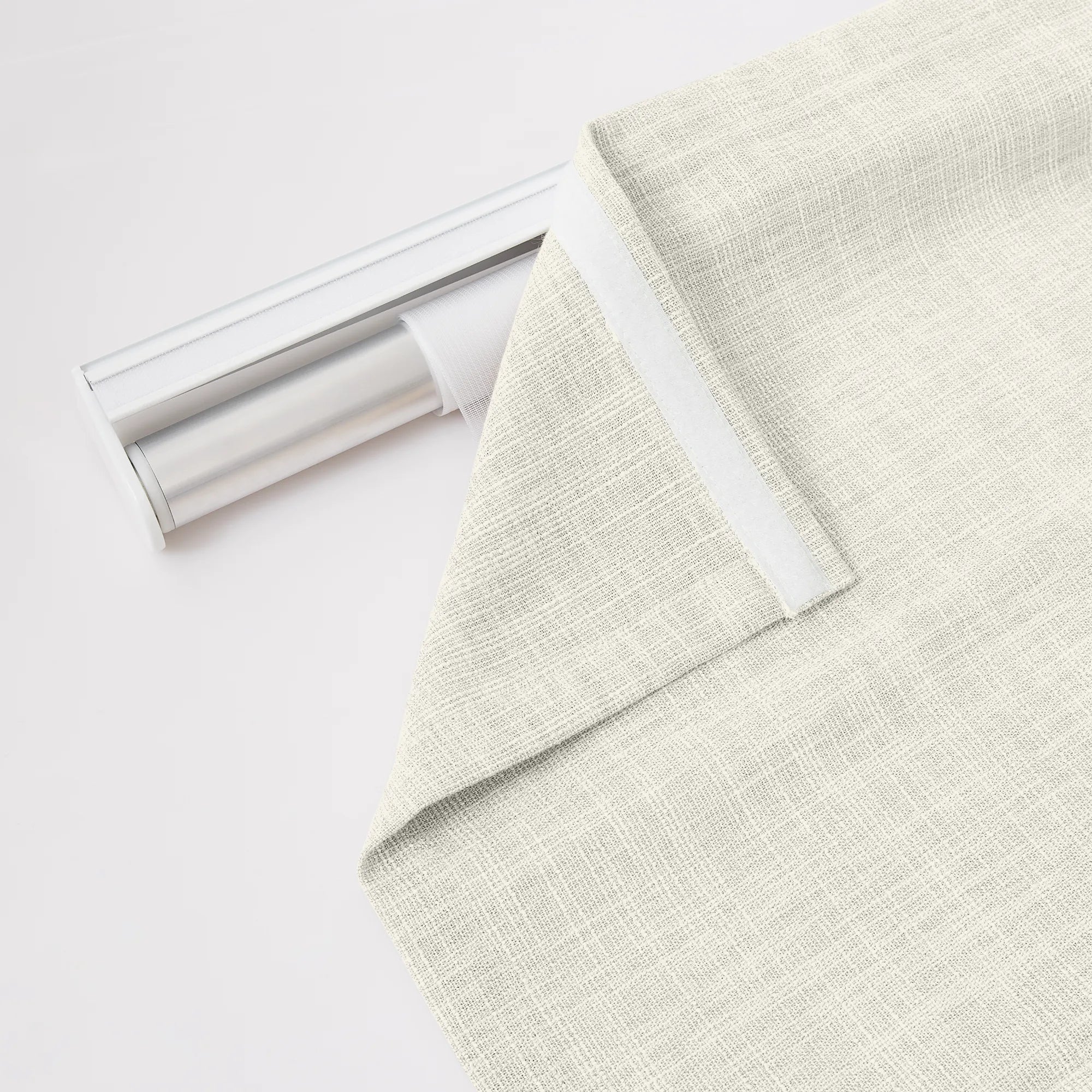 Fiora Cotton Roman Shades MBH9520-2 scene 4 - soft oat cotton fabric, sleek tailored folds, whisper-quiet motorized system, showcased in a bright, open-concept dining room with natural light and minimalist neutral decor