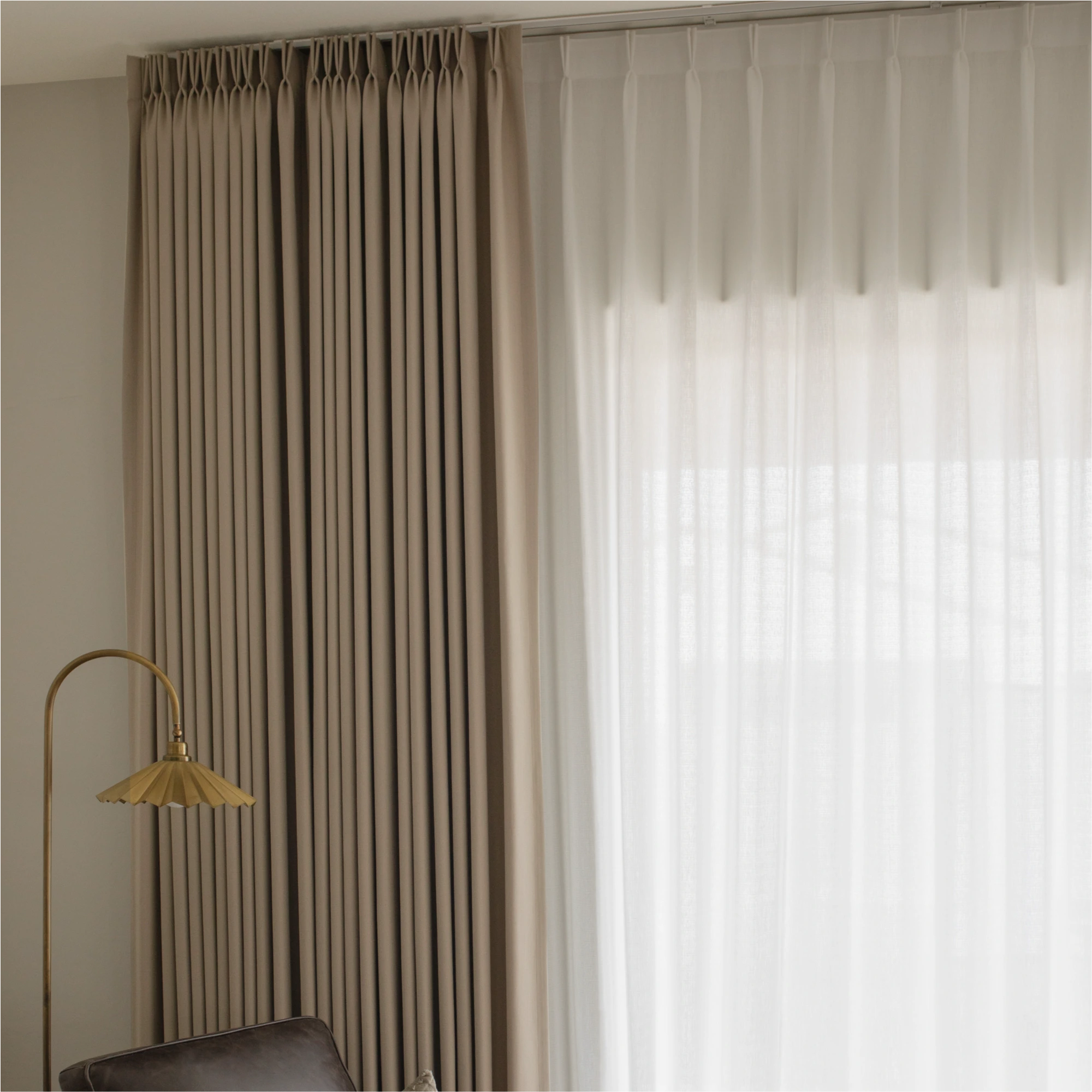 Ilythra cotton curtains in a living room mid-range view 3 highlighting fabric texture and soft light filtering for a cozy interior