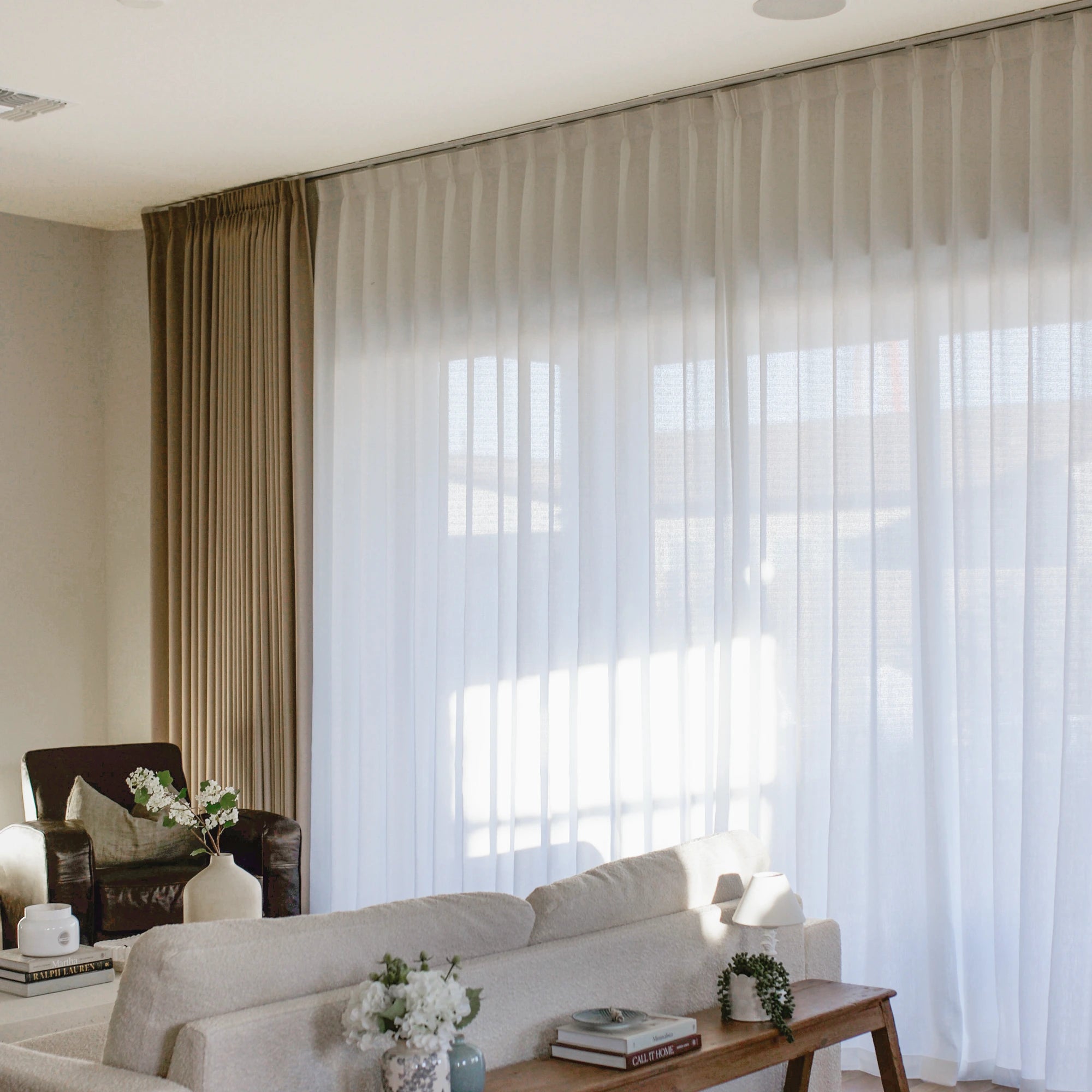 Ilythra cotton curtains in a living room scene view 5 highlighting soft drape, natural light filtering, and a clean modern interior setting