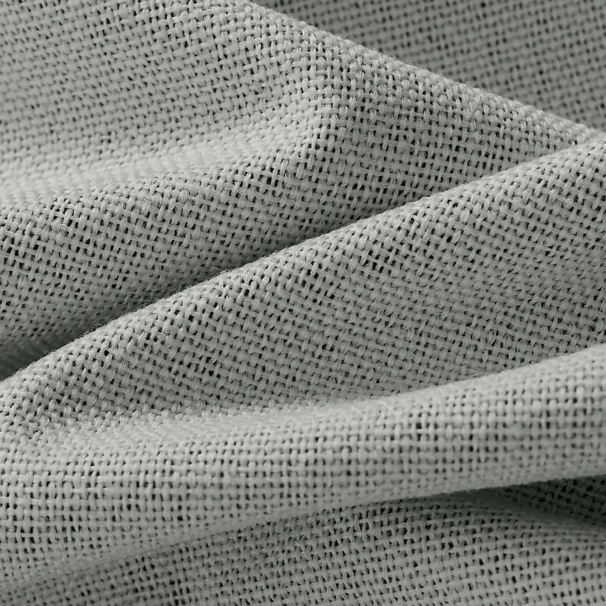 Isadora OY6-238-11 detail 1 100% blackout curtains showing fabric texture and light blocking effect