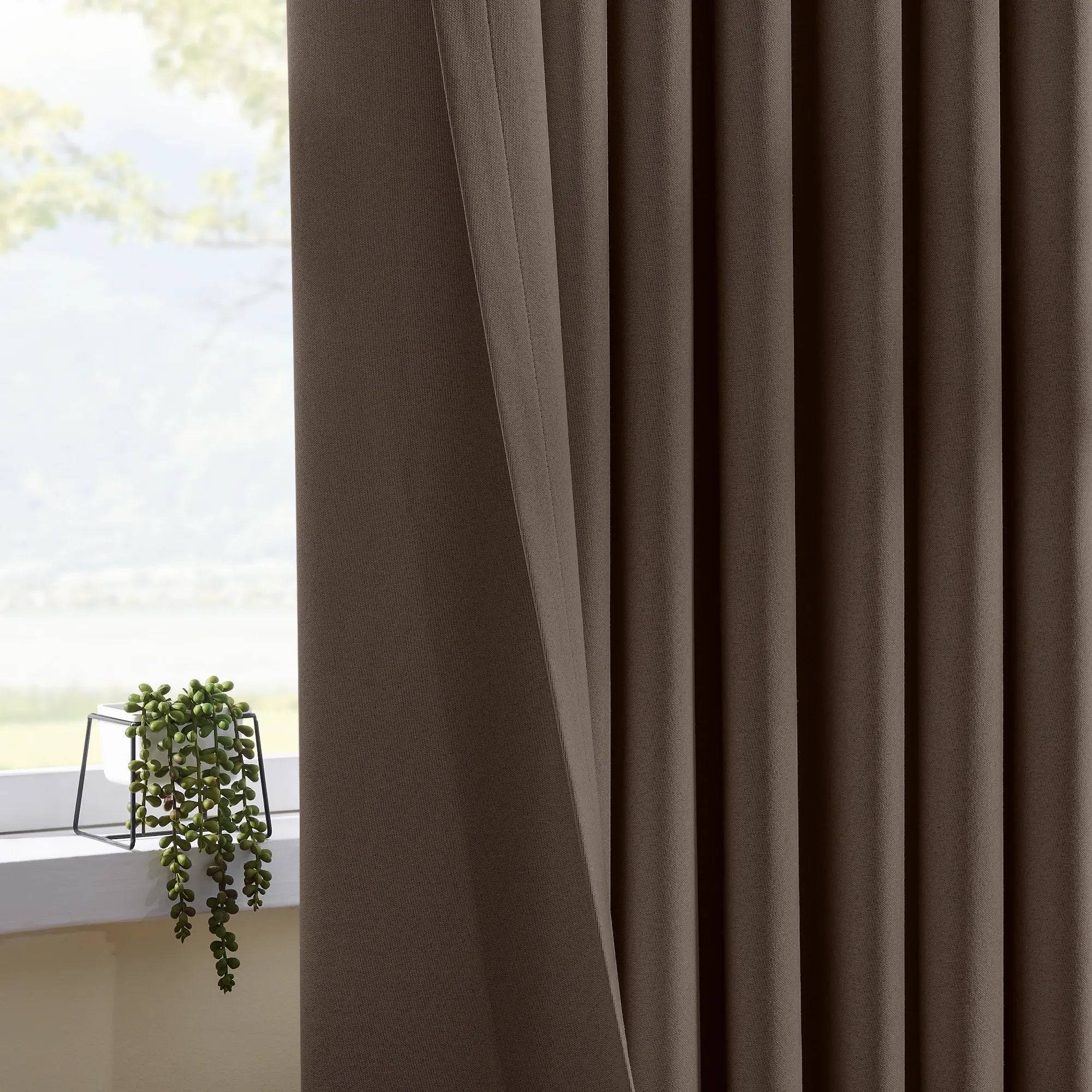 Isadora OY6-238-26 scene 4 100% blackout curtains showcasing room darkening effect and elegant drape
