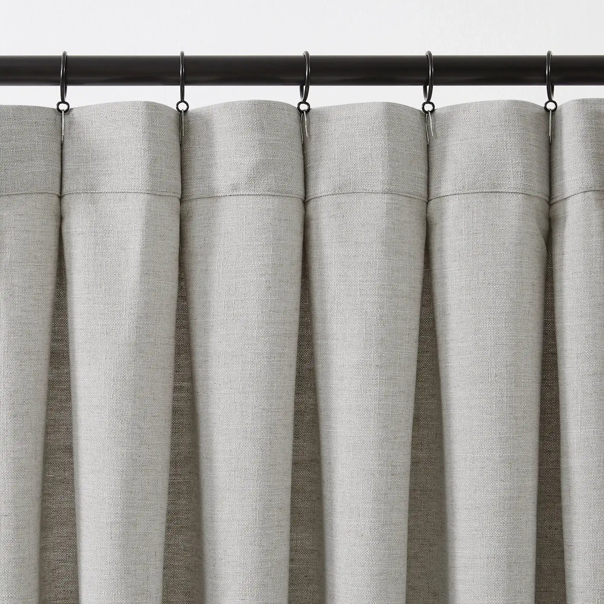 Jovienne linen cotton blend curtain, soft with modern draping, hook details displayed