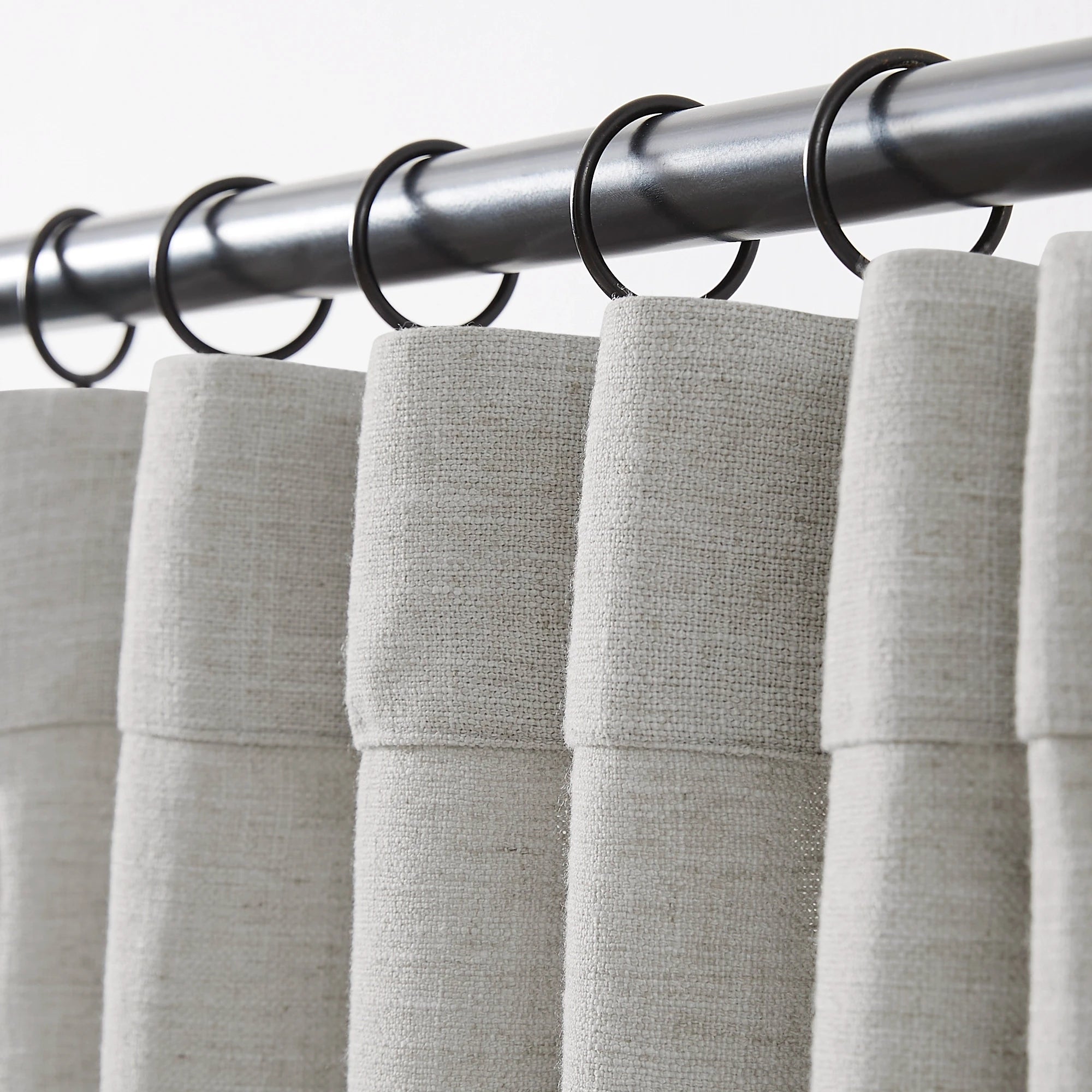 Jovienne linen cotton blend curtain, soft with modern draping, hook details displayed