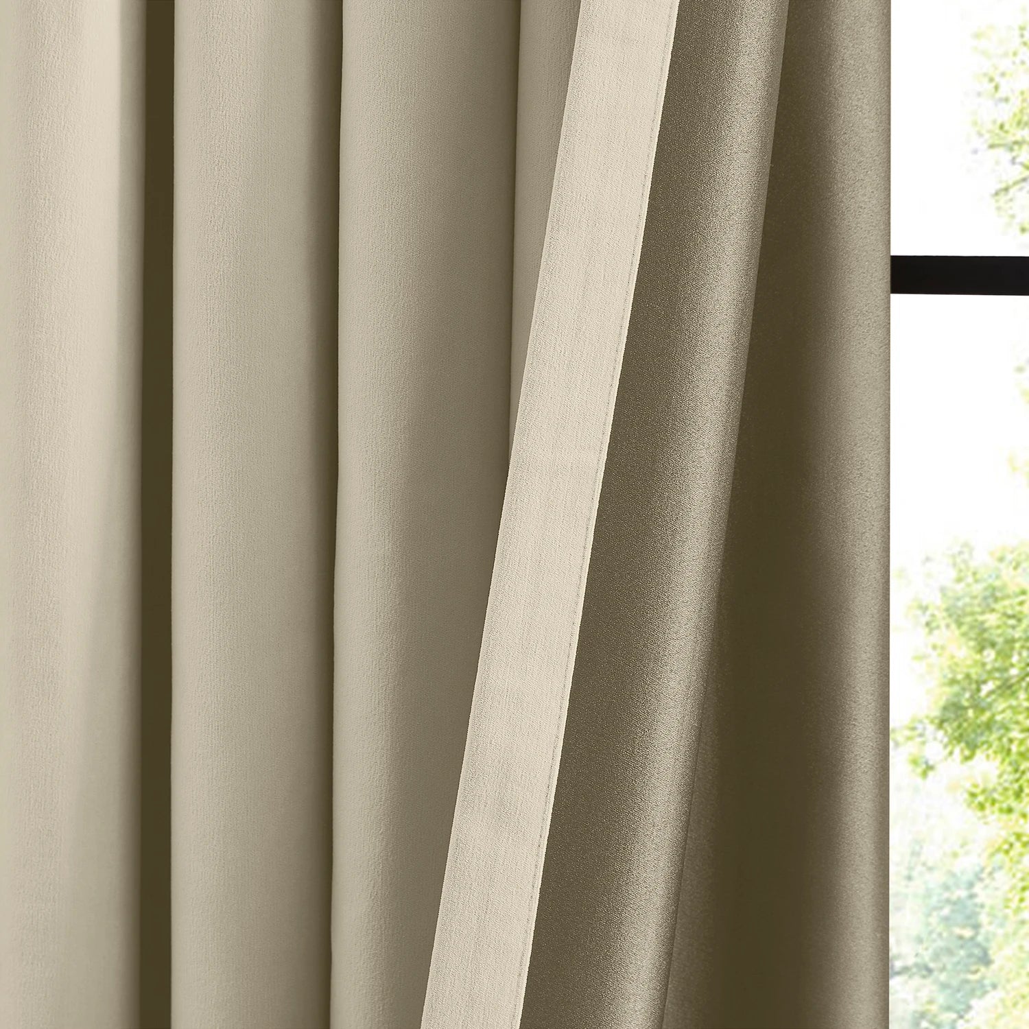 Lyra cloud-1_scene_5 velvet-like texture blackout curtains with luxurious draping effect in a modern home interior