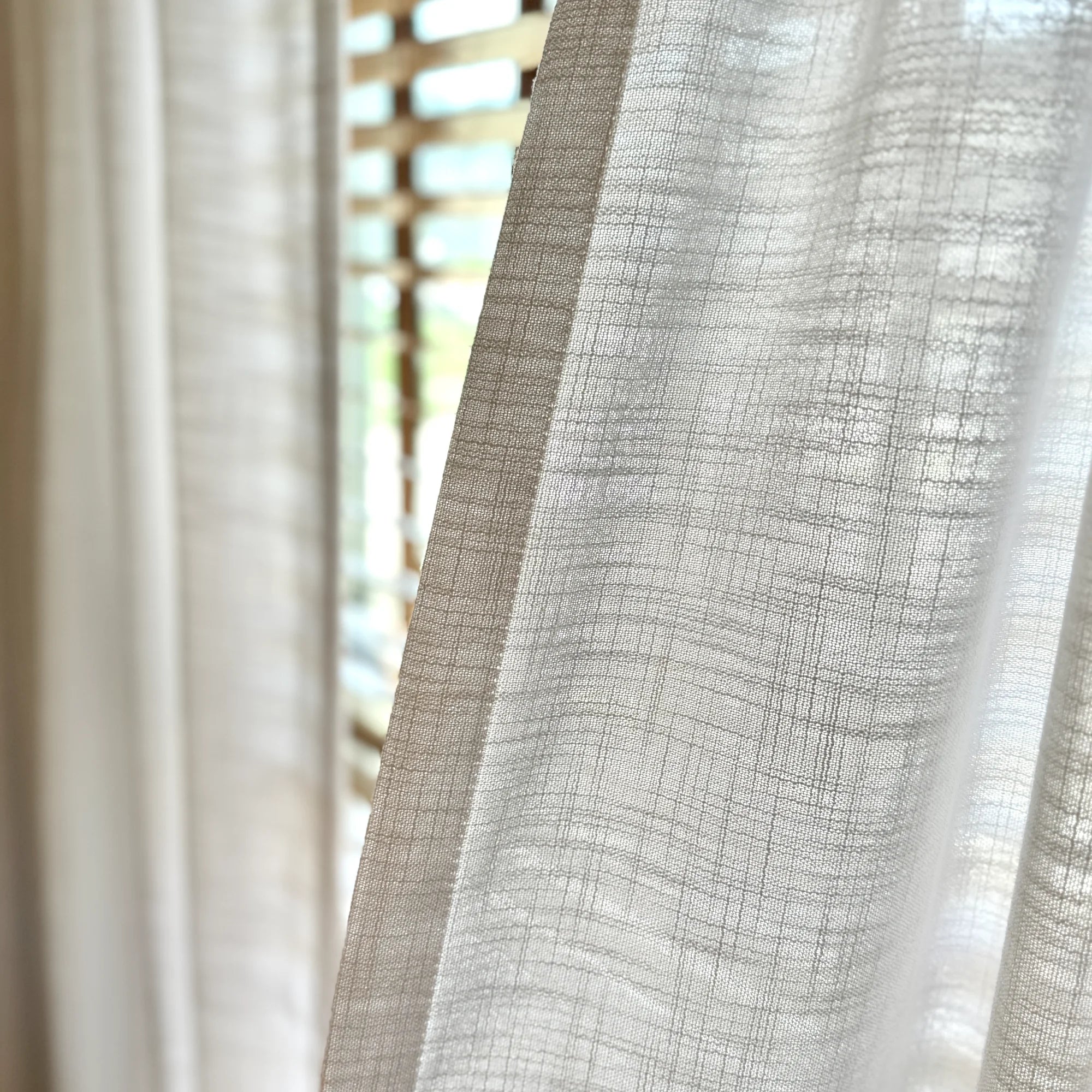 Marisol Linen Curtains adding a touch of sophistication to your living room, perfect for natural light.