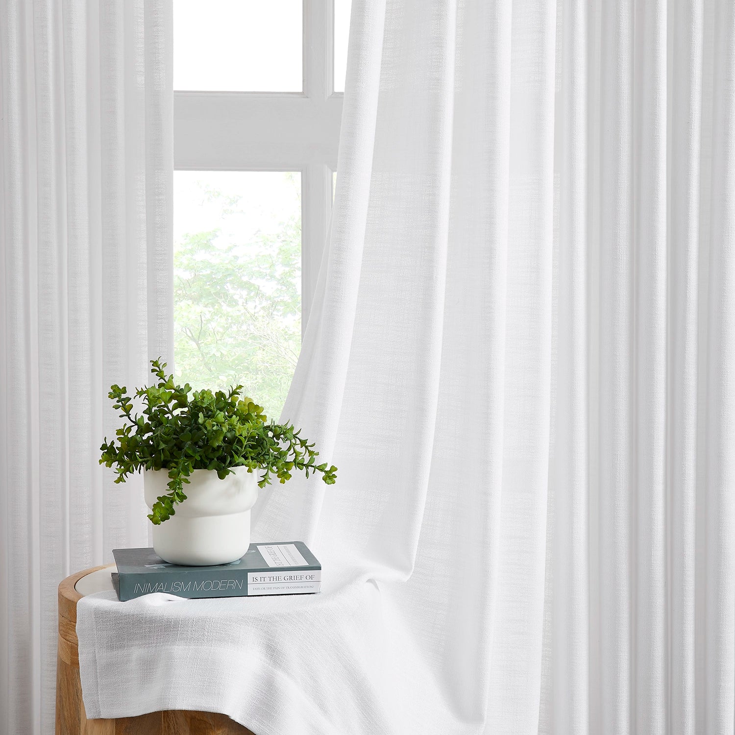 Marisol Linen Curtains adding a touch of sophistication to your living room, perfect for natural light.