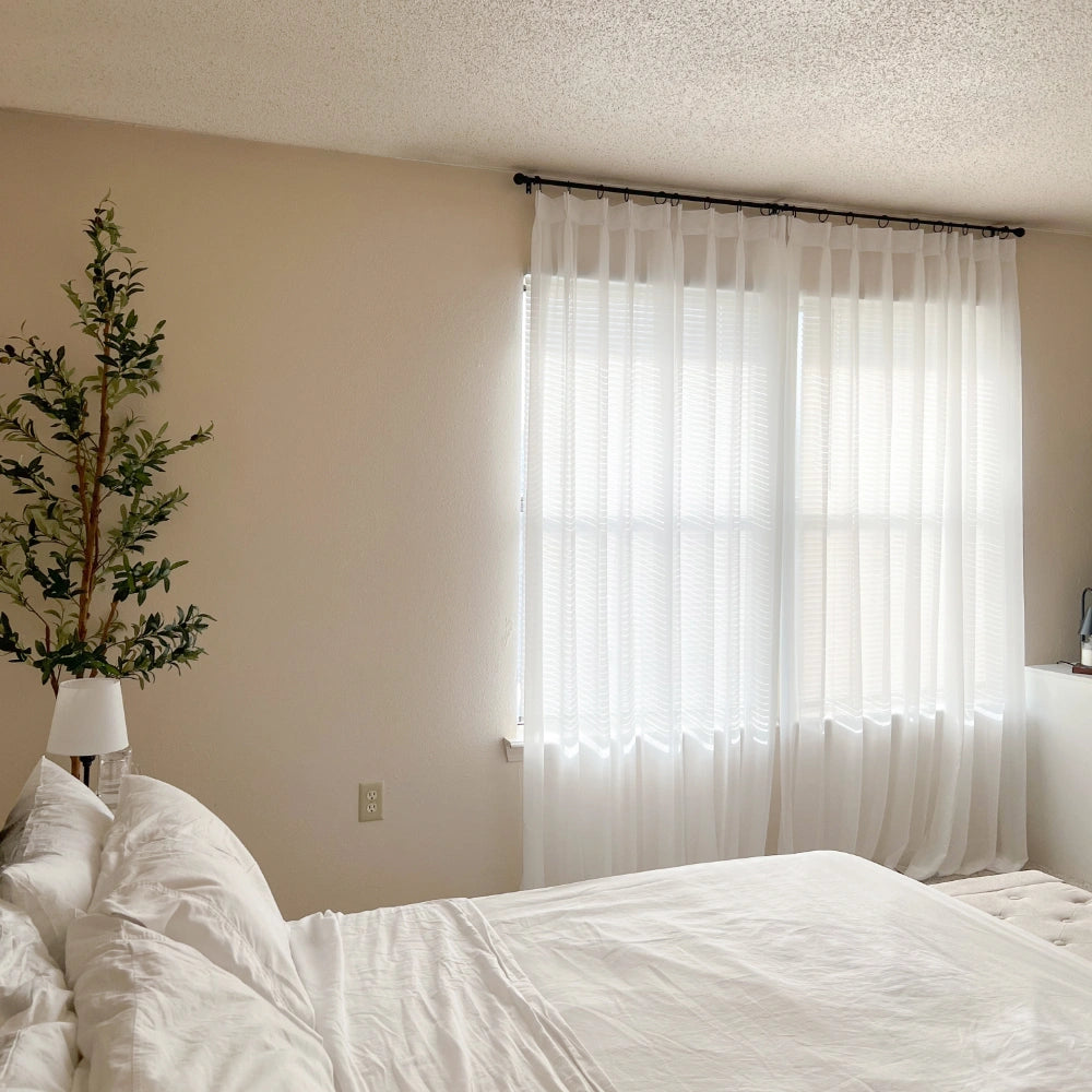 Mira Solid Sheer Curtains inf_1 for large windows, closed light filtering drapes styled in a cozy bedroom space
