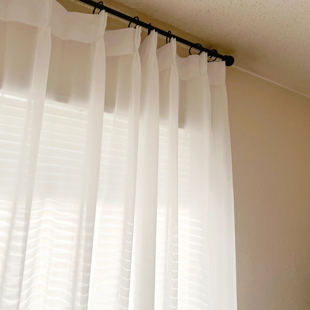 Mira Solid Sheer Curtains inf_5 for large windows showing light filtering sheer drapes in a bright interior space