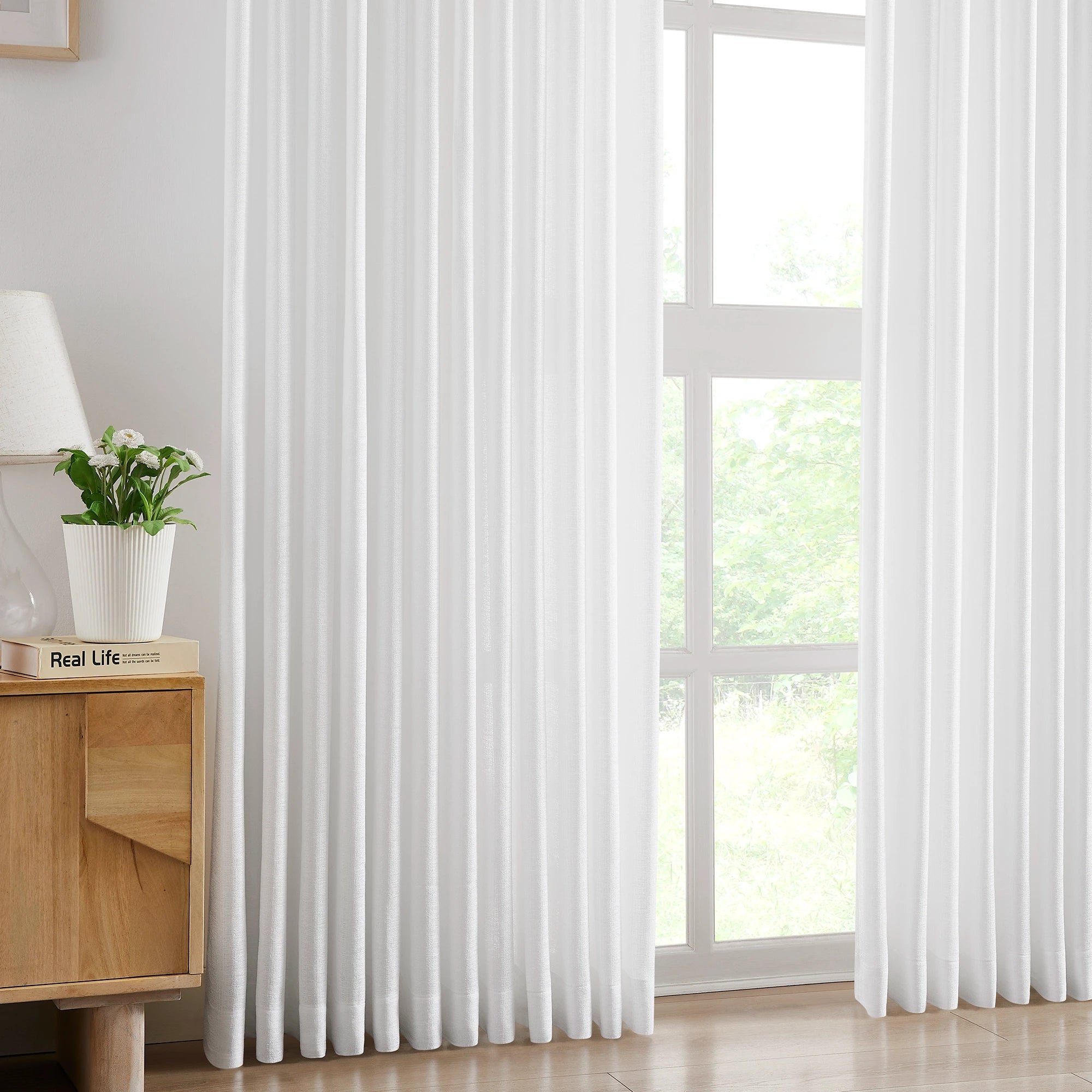 Nova 1 scene 2 semi-sheer elegant drapes for large windows showcasing the curtains in a home interior