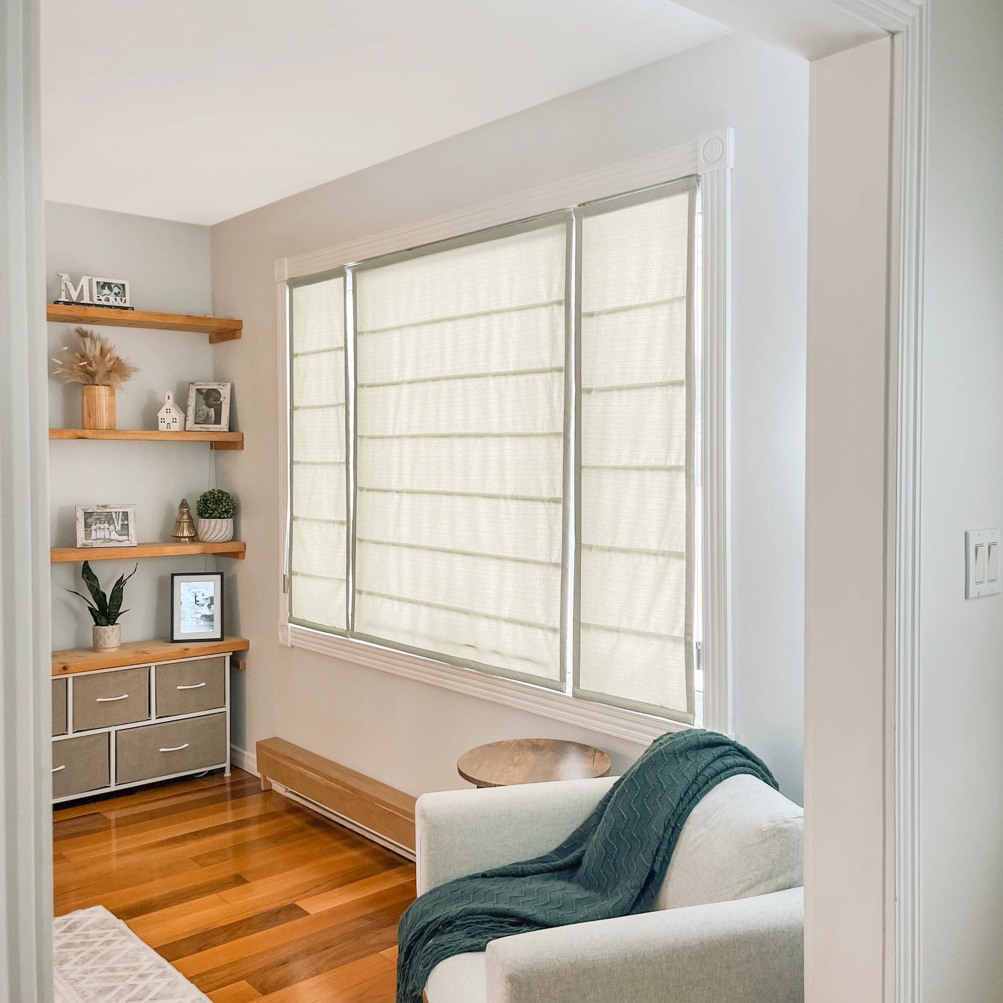 Seraphine Linen Texture Roman Shade: Image 9013-2-3-main displaying a classic full-window view with clean tailored folds, rich linen texture, and a timeless neutral tone in a bright contemporary home setting