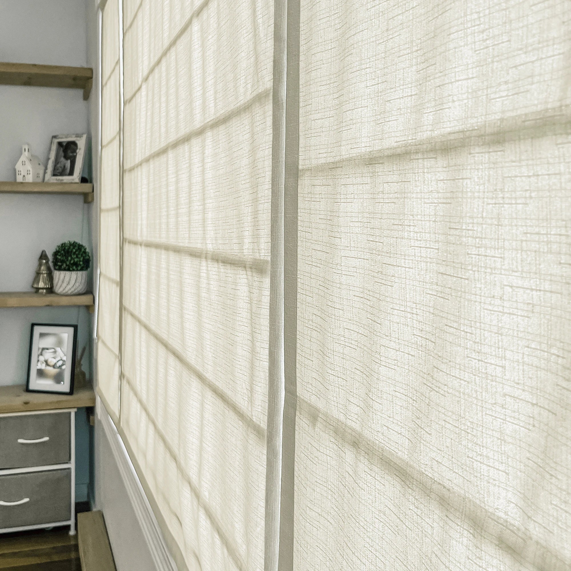 Seraphine Linen Texture Roman Shade: Image 9013-2-4 presenting a sleek linen-textured roman shade with even tailored folds, soft natural texture, and versatile neutral window styling