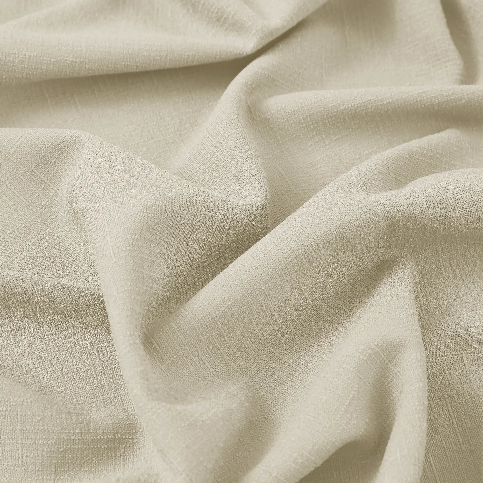 Seraphine linen texture curtains detail showing light filtering feature and soft drapery texture