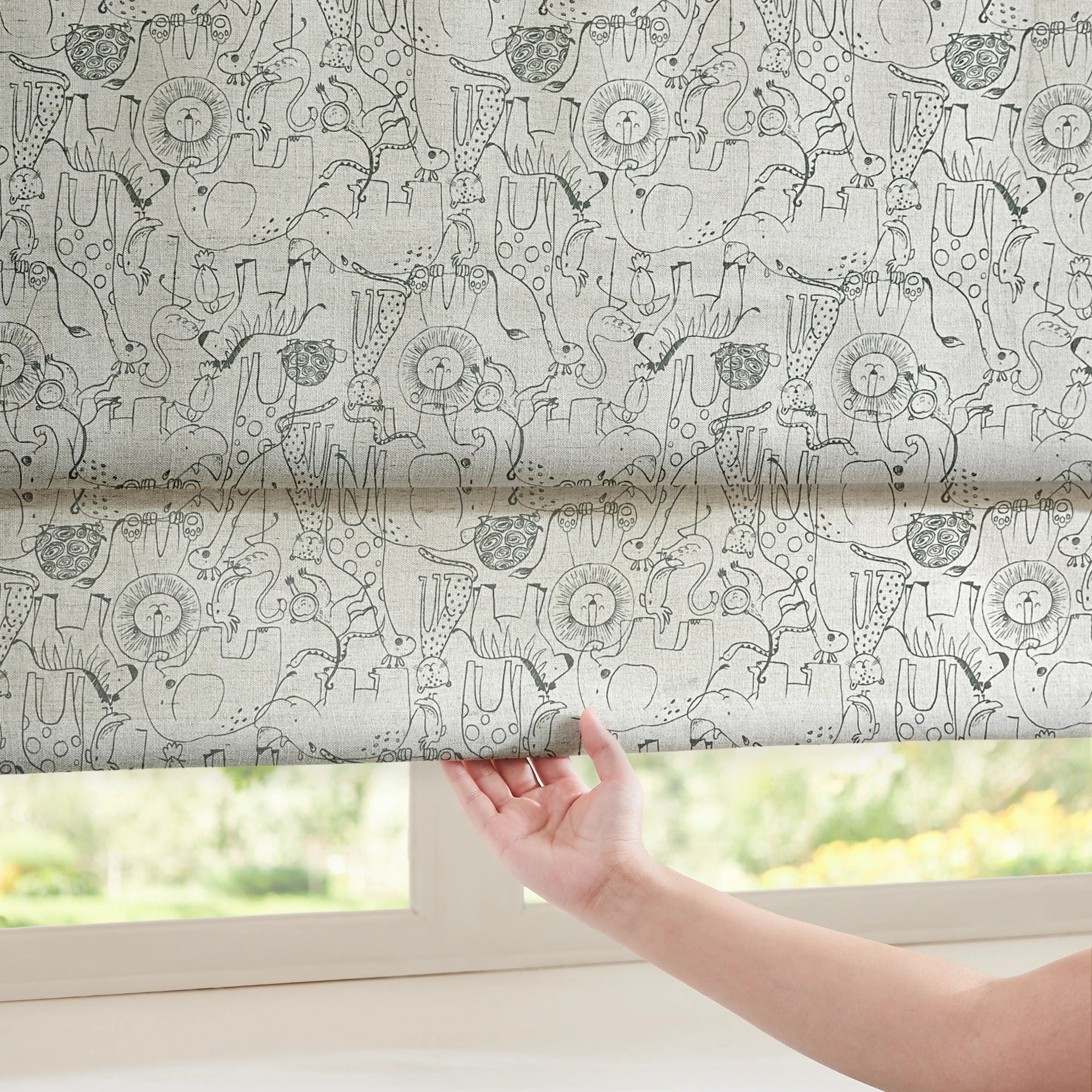 Wynara Black Safari Animal Sketch Blackout Roman Shades: Image 1388-16_scene_3 showcases the roman shade with stylish safari animal sketch design, excellent blackout performance and elegant home scene coordination.