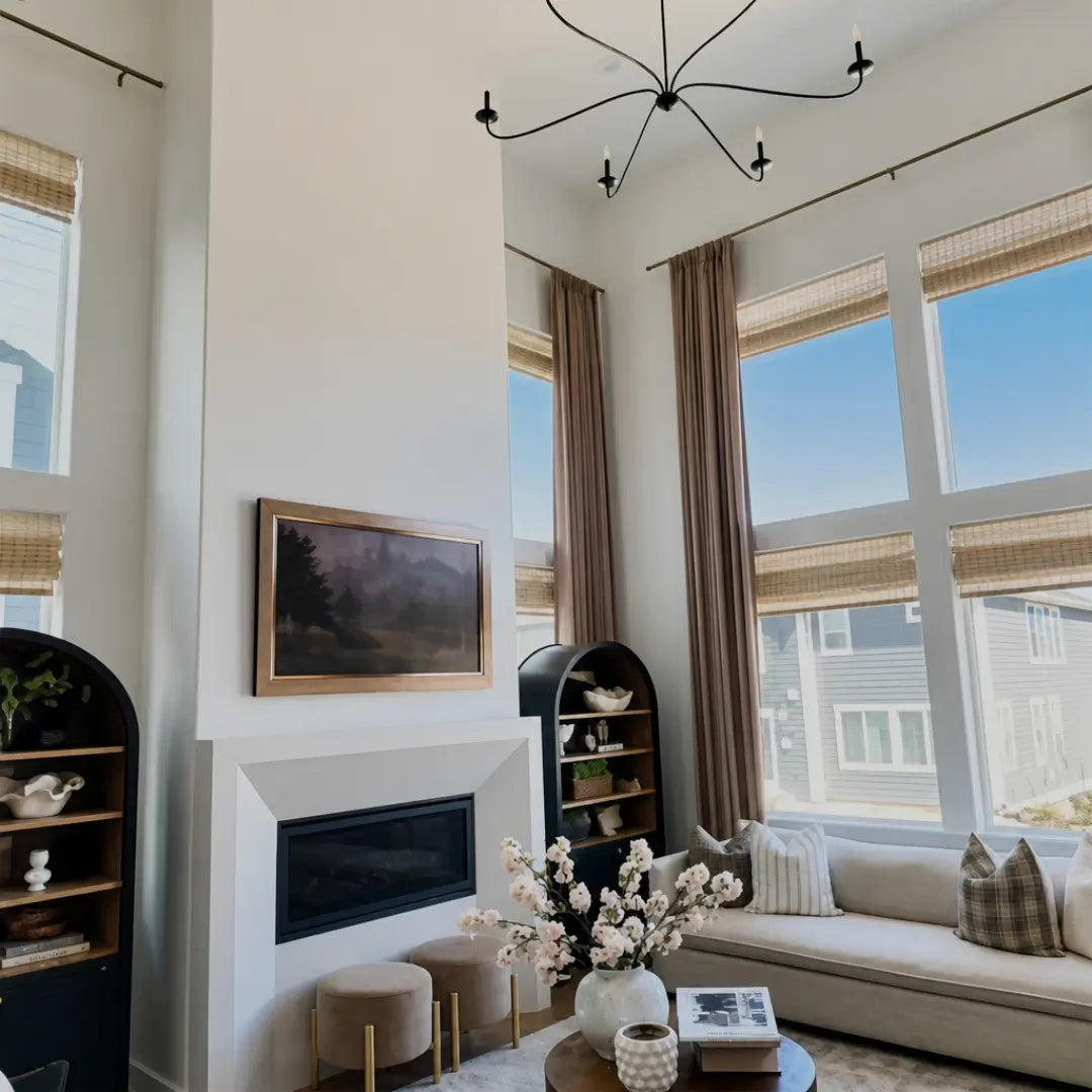 Translation missing: en.Modern living room with a fireplace, sofa, and large windows