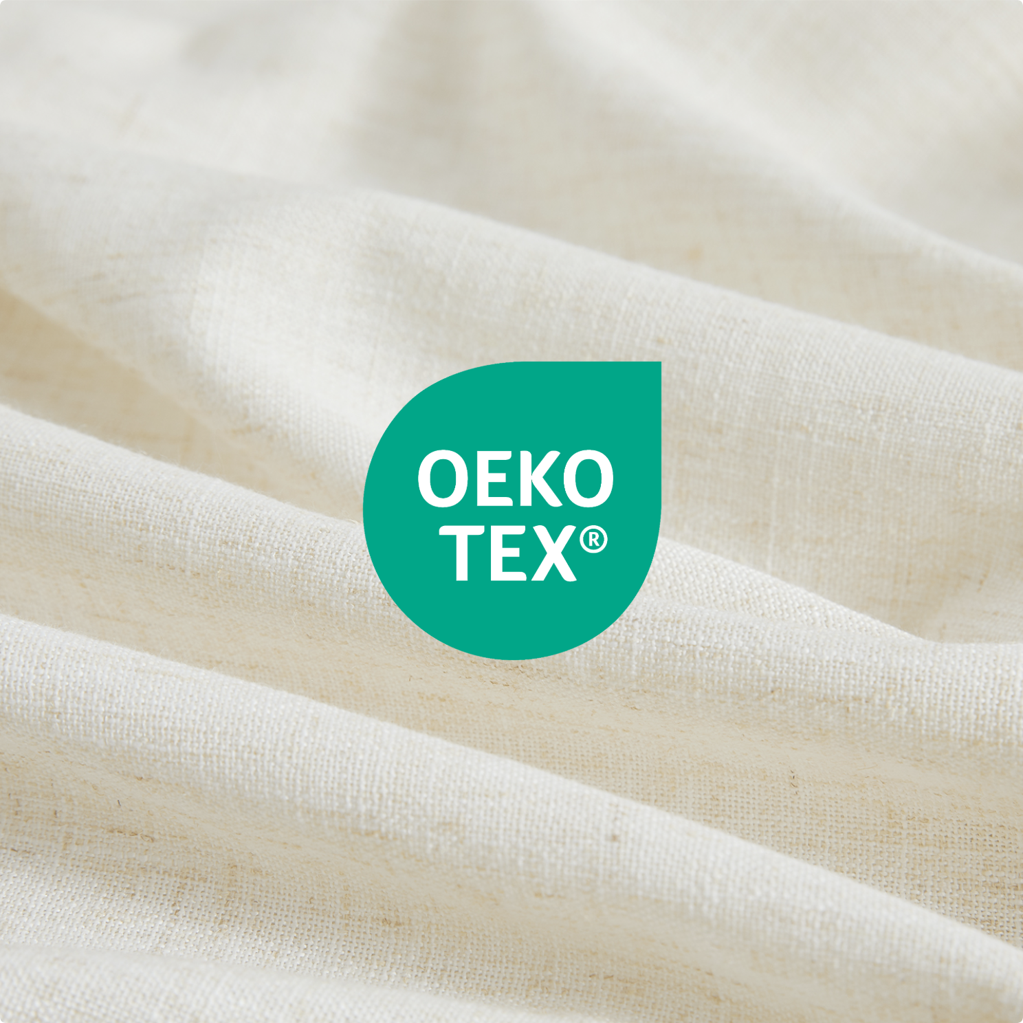 Close-up of OEKO-TEX logo on a fabric background
