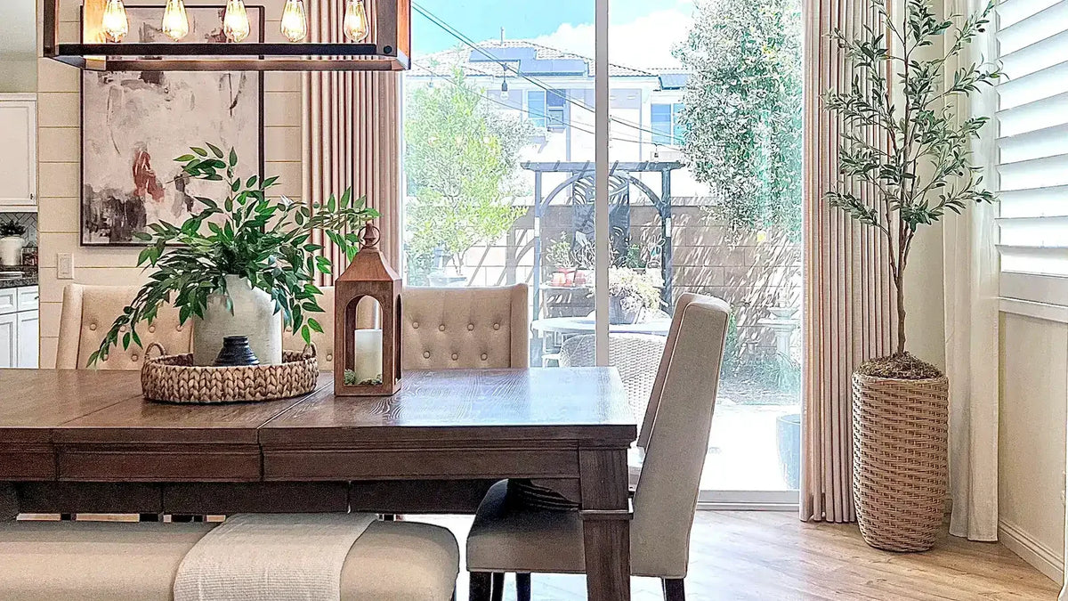 Pinch-pleated linen-blend curtains beside a sliding door in a farmhouse dining room