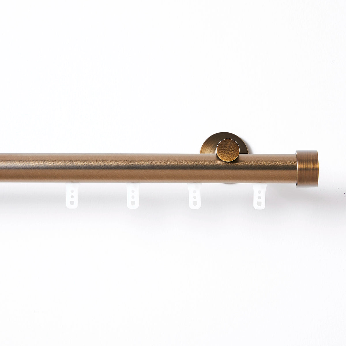 Darian Single Custom Traverse Curtain Rod Rod-2 in Antique Bronze finish showing traverse curtain rod with gliding pulley mechanism