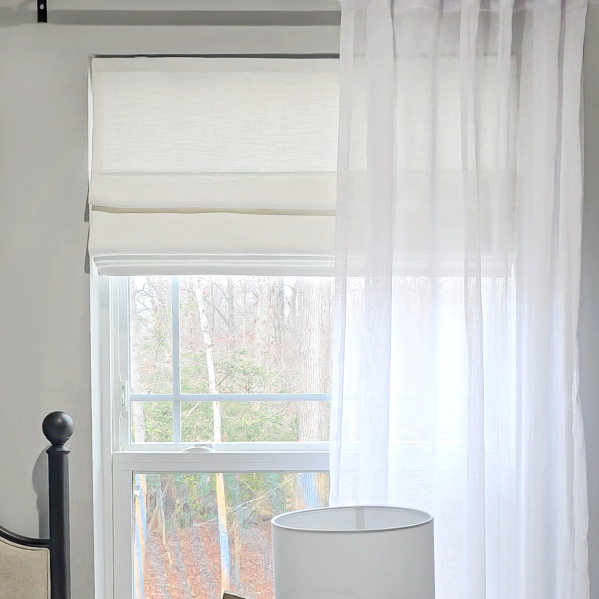 Elowen Heavyweight Textured Roman Shades: Image 7084-4-3 captures a side-angle detail of the shade in a soft neutral tone, highlighting its thick, dimensional fabric with a pronounced slub texture. The heavyweight material forms deep, structured horizontal folds, while expert stitching and a smooth cordless mechanism ensure a clean, tailored drape. The fabric’s matte surface diffuses light gently, underscoring its luxe, durable build and modern minimalist design.