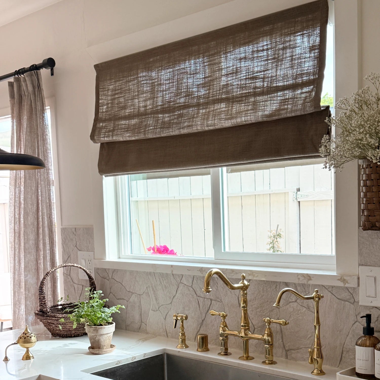 Elara 89850-10 elegant linen Roman shades open over a kitchen sink view 4