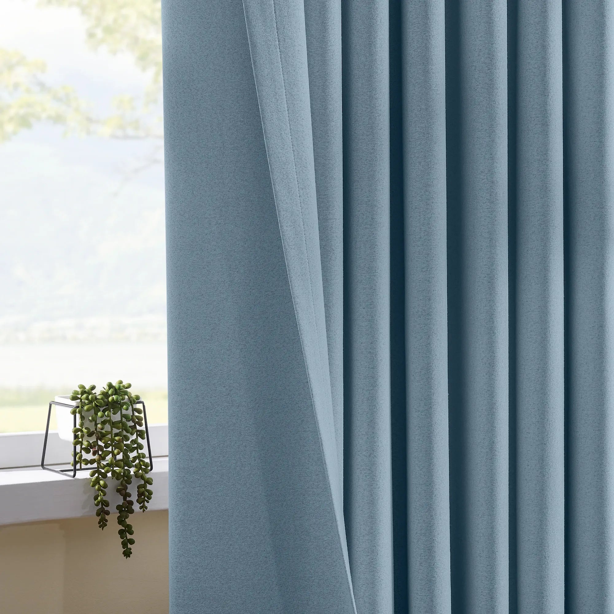 Isadora OY6-238-21 scene 4 100% blackout curtains displaying light blocking effect and elegant draping